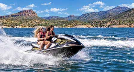 Jet ski on Bartlett Lake open water and desert shoreline in Tonto National Forest Arizona