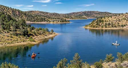 Black Canyon Lake Arizona with a kayaker and fisherman on the Mogollon Rim