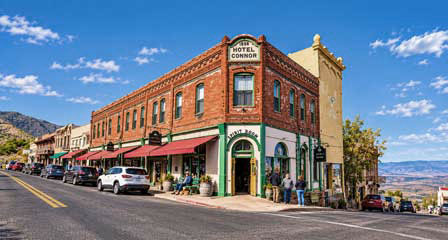 Historic Hotel Connor and downtown storefronts along the steep streets of Jerome Arizona