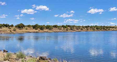 Kinnikinick Lake near Flagstaff Arizona in the high country grasslands with scattered juniper and pine trees
