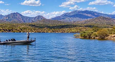 Bass boat fishing on Lake Pleasant with desert mountains near Phoenix Arizona