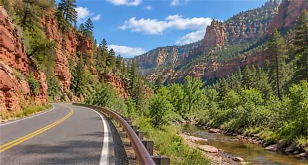 Oak Creek Canyon Scenic Drive on Highway 89A winding through red sandstone cliffs and forest near Sedona Arizona