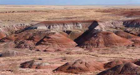 Sweeping Painted Desert badlands with layered mesas and sculpted hills in northeastern Arizona