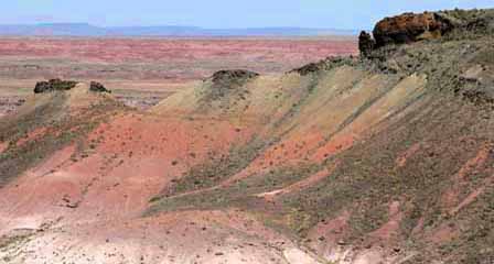 Red and orange layered hills and eroded badlands in Arizona's Painted Desert