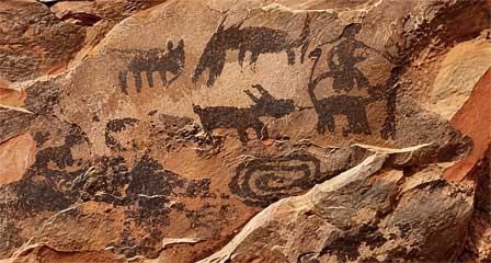 Ancient painted pictographs on a sandstone rock wall at Palatki Heritage Site near Sedona
