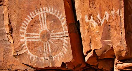 Ancient animal figures and dark pictographs painted on sandstone at Palatki Heritage Site near Sedona