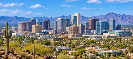 Downtown Phoenix Arizona skyline with city buildings and desert mountains