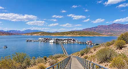 Roosevelt Lake Marina with boats and desert mountains in the Tonto Basin Arizona