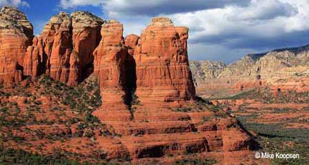 Coffee Pot Rock sandstone formation rising above the desert landscape in Sedona Arizona