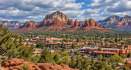 Downtown Sedona Arizona with shops and buildings surrounded by red rock scenery