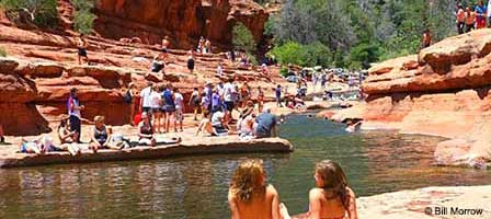 Natural sandstone water slide and Oak Creek pools at Slide Rock State Park in Oak Creek Canyon near Sedona Arizona