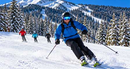 Skiers enjoying snow-covered mountain slopes in northern Arizona