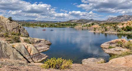 Kayakers on Willow Lake surrounded by the Granite Dells in Prescott Arizona