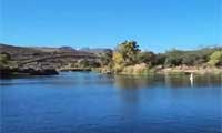 Patagonia Lake at Patagonia Lake State Park in southern Arizona surrounded by rolling desert hills