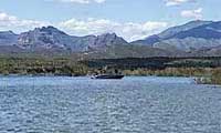 Boating on Lake Pleasant surrounded by Sonoran Desert and mountain scenery in Arizona