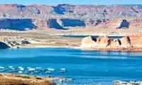 Lake Powell at sunset surrounded by sandstone canyon walls near Page Arizona